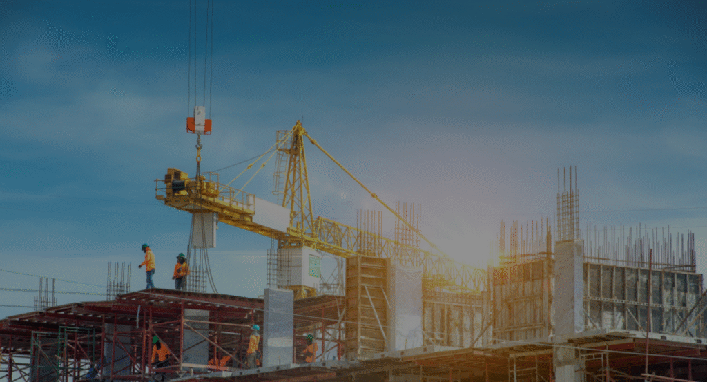 Modern industrial construction site in Houston TX with general contractors managing durable steel and concrete structures.